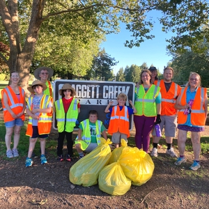 volunteers at claggett creek park picking up litter